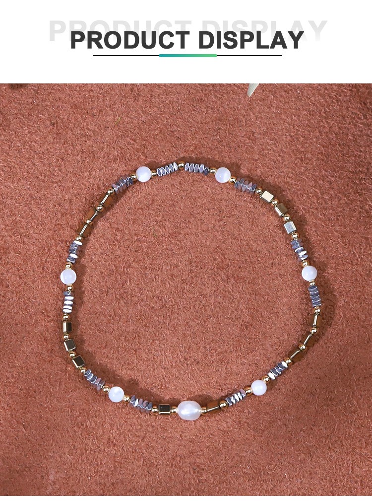 Bracelet - Pearl -4*5mm  white moonlight - Round bead -3.5mm  Hemitite - Square -2*1mm  Hemitite - bead - triangle - Gold -3*3mm  copper bead -2mm- elastic rope